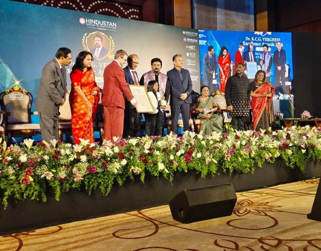 Victoria-Isaac-collects-her-citation-at-the-Dr.-K.C.G.-Verghese-Excellence-Awards-2026-in-Chennai.-The-screen-at-the-left-of-the-stage-carried-her-name-and-her-stage-name-Victoriastic.jpg
